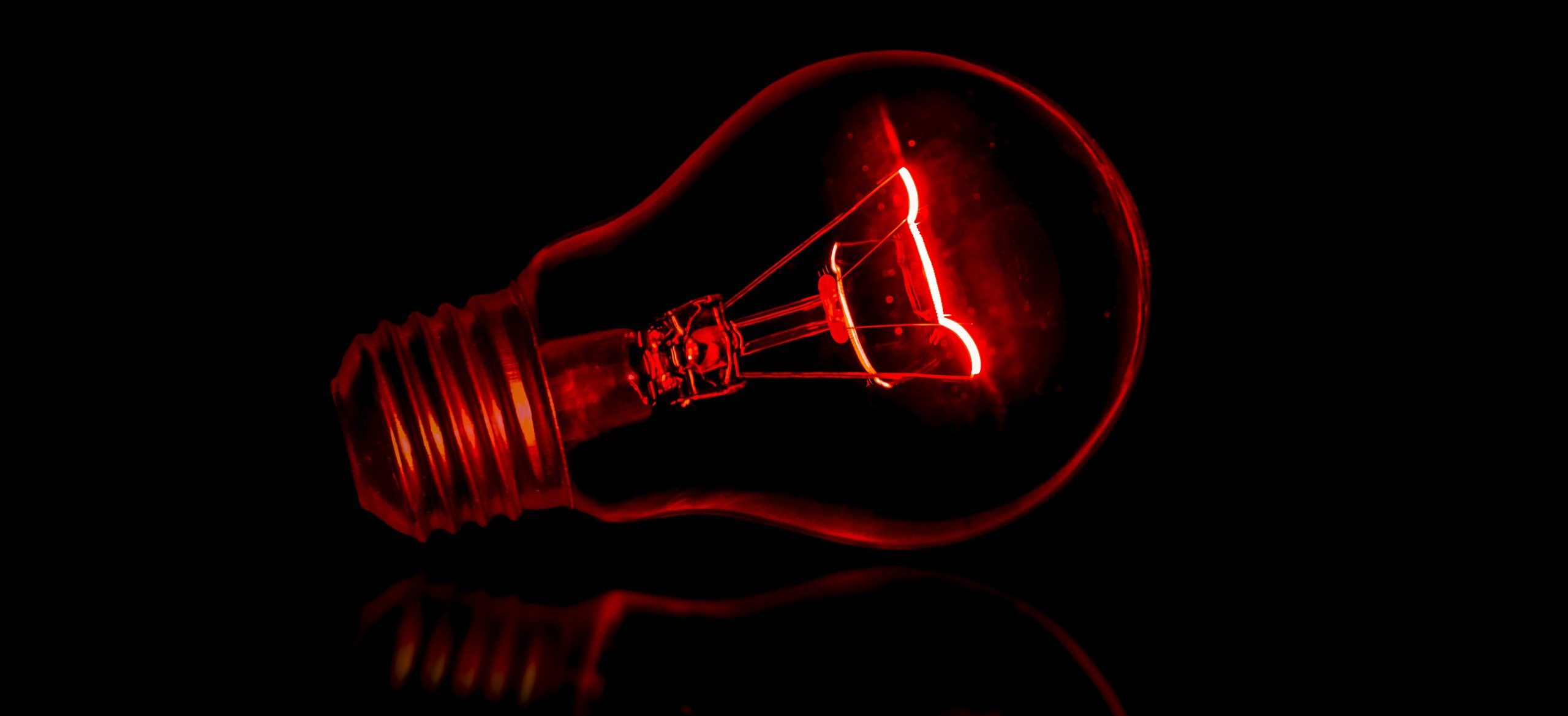A picture of a lightbulb on a black background