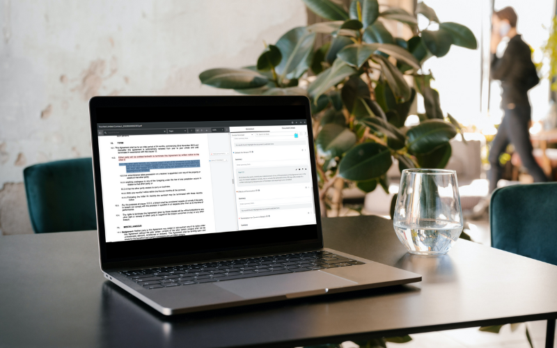 A laptop computer with a client portal software open on the screen